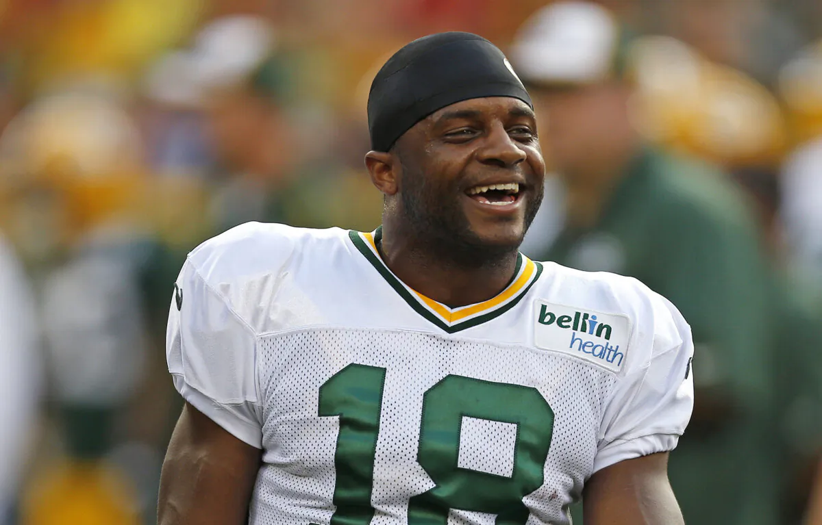 Green Bay Packers wide receiver Randall Cobb jokes around with teammates during the Family Night practice of NFL football training camp, in Green Bay, Wis., on Aug. 2, 2014. (Matt Ludtke/AP Photo)