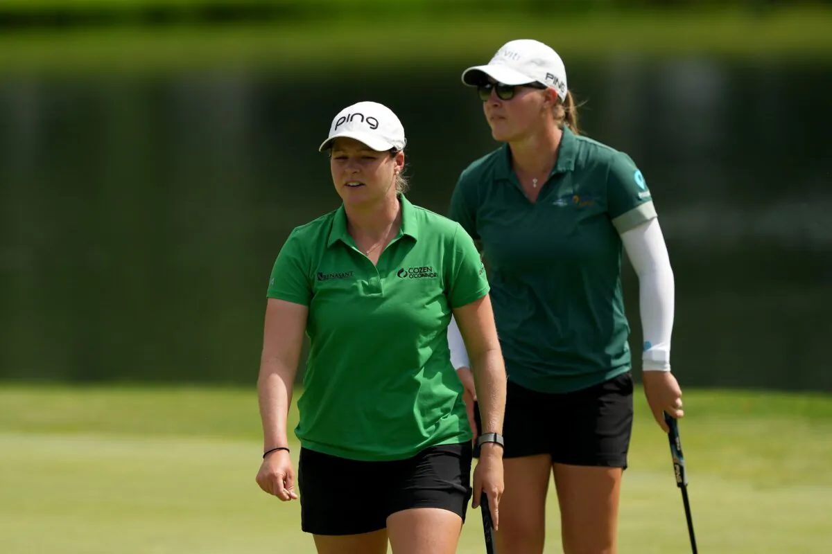 Ally Ewing (L) and teammate Jennifer Kupcho of the United States walk on the fifth green during the third round of the Dow Championship in Midland, Mich., on June 29, 2024. (Dylan Buell/Getty Images)