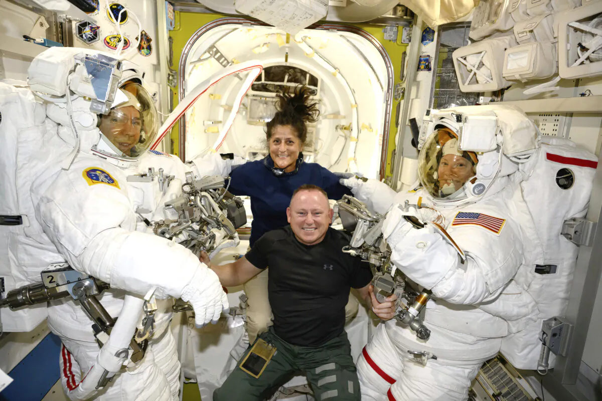 Boeing Crew Flight Test astronauts Suni Williams and Butch Wilmore (center) pose with Expedition 71 Flight Engineers Mike Barratt (L) and Tracy Dyson, both NASA astronauts, in their spacesuits aboard the International Space Station's Quest airlock on June 24, 2024. (NASA via AP)