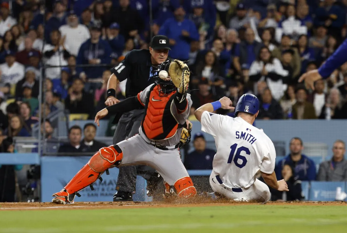 Will Smith (16) of the Los Angeles Dodgers slides home to score a run against catcher Patrick Bailey (14) of the San Francisco Giants during the third inning in San Francisco on June 29, 2024. (Kevork Djansezian/Getty Images)