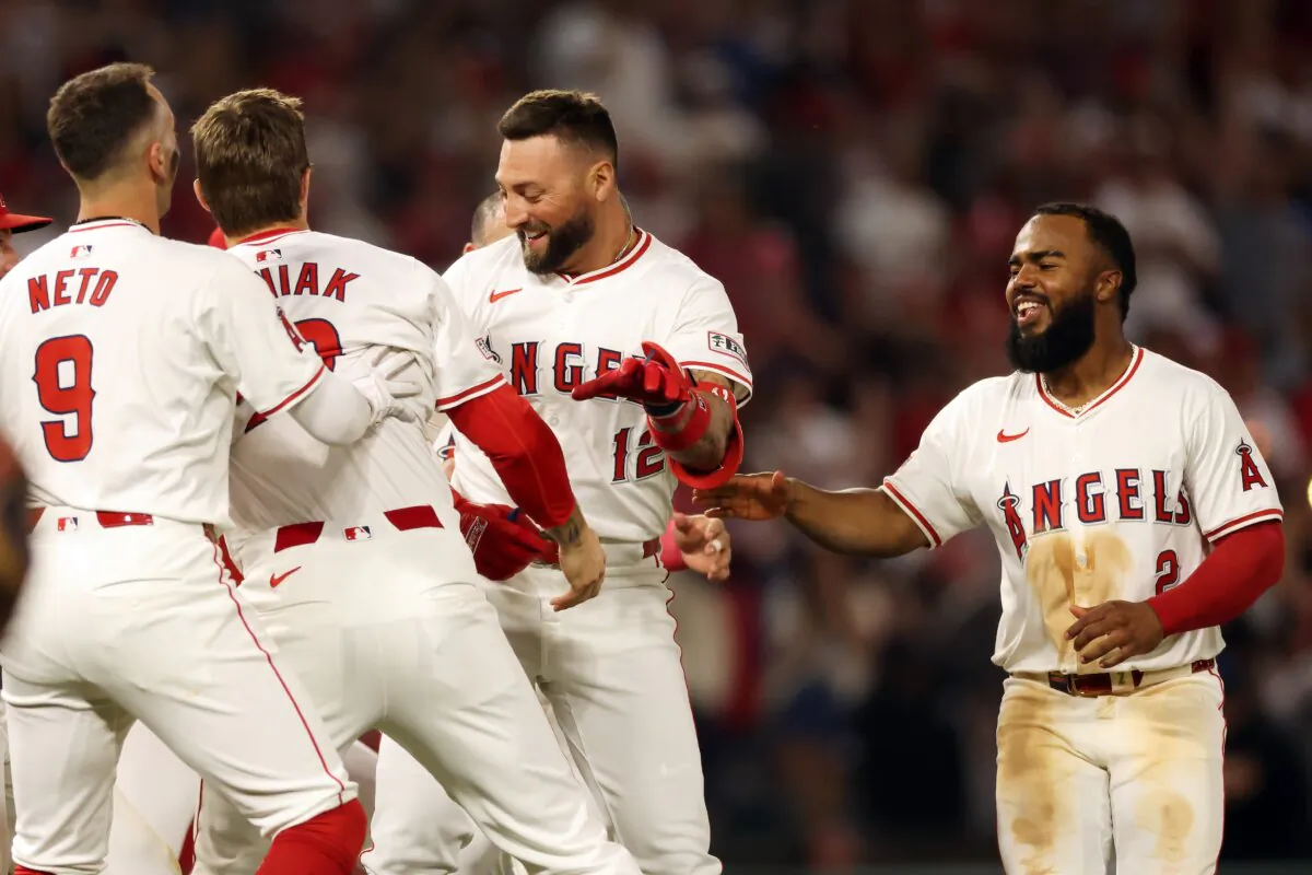 Kevin Pillar (12) of the Los Angeles Angels celebrates with teammates after hitting a walk off RBI single to win 6–5 against the Detroit Tigers in Anaheim, Calif., on June 29, 2024. (Katelyn Mulcahy/Getty Images)