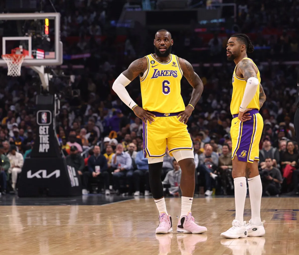 LeBron James (6) of the Los Angeles Lakers and D'Angelo Russell (1) talk during the first half against the LA Clippers in Los Angeles on April 5, 2023.(Harry How/Getty Images)