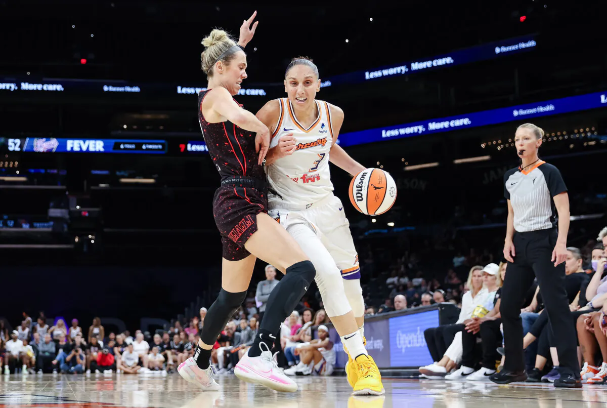 Diana Taurasi #3 of the Phoenix Mercury handles the ball against Lexie Hull #10 of the Indiana Fever during the second half of the WNBA game at Footprint Center in Phoenix on June 27, 2022. (Christian Petersen/Getty Images)