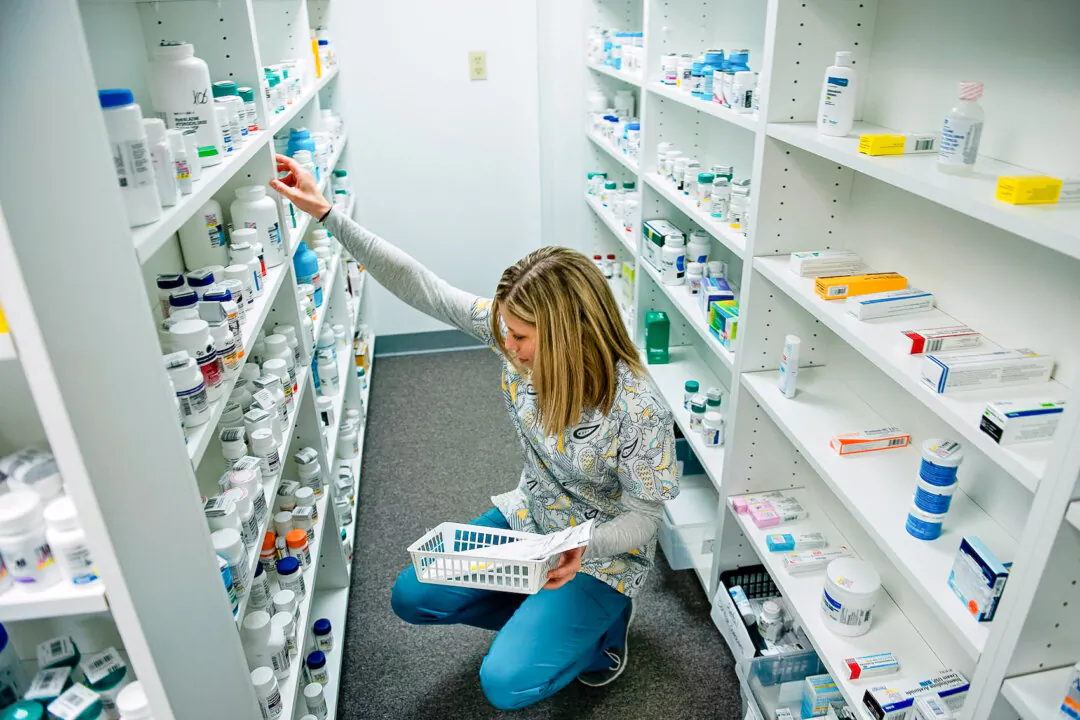 A staff member sorts through drugs drugs while filling a prescription at a pharmacy in Blacksville, W.Va., on March 21, 2017. (Brendan Smialowski/AFP via Getty Images)