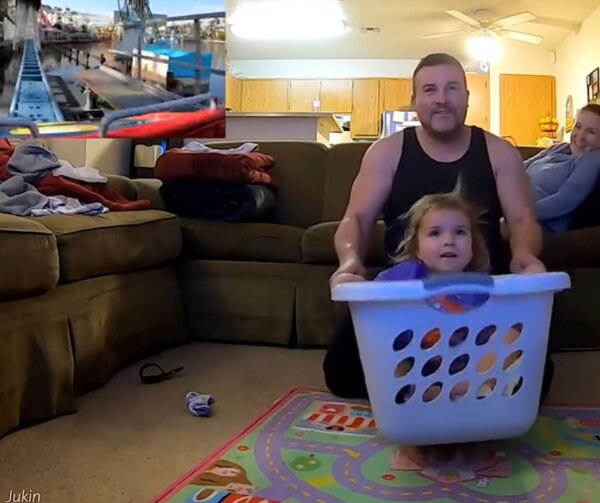 Dad Takes Toddler Daughter for Pretend Rollercoaster Ride in Laundry Basket