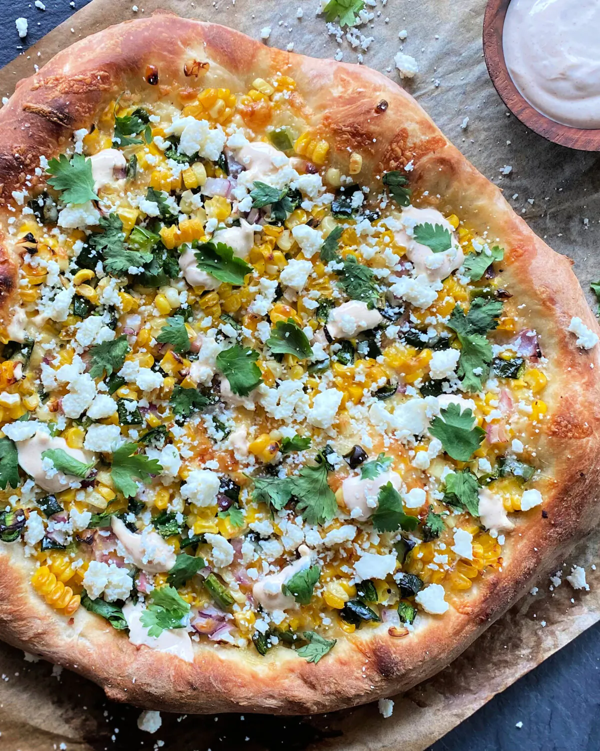 Both the corn topping and the pizza itself are grilled for extra smoky flavor. (Lynda Balslev for Tastefood)