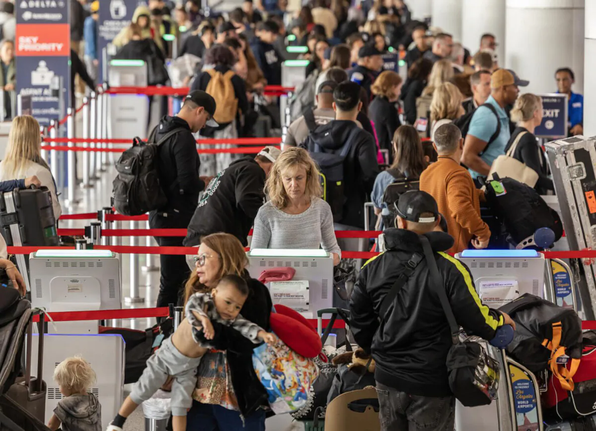 Travelers receive boarding passes and check in baggage at the Delta Airlines terminal at Los Angeles International Airport on May 23, 2024. (Myung J. Chun/Los Angeles Times/TNS)