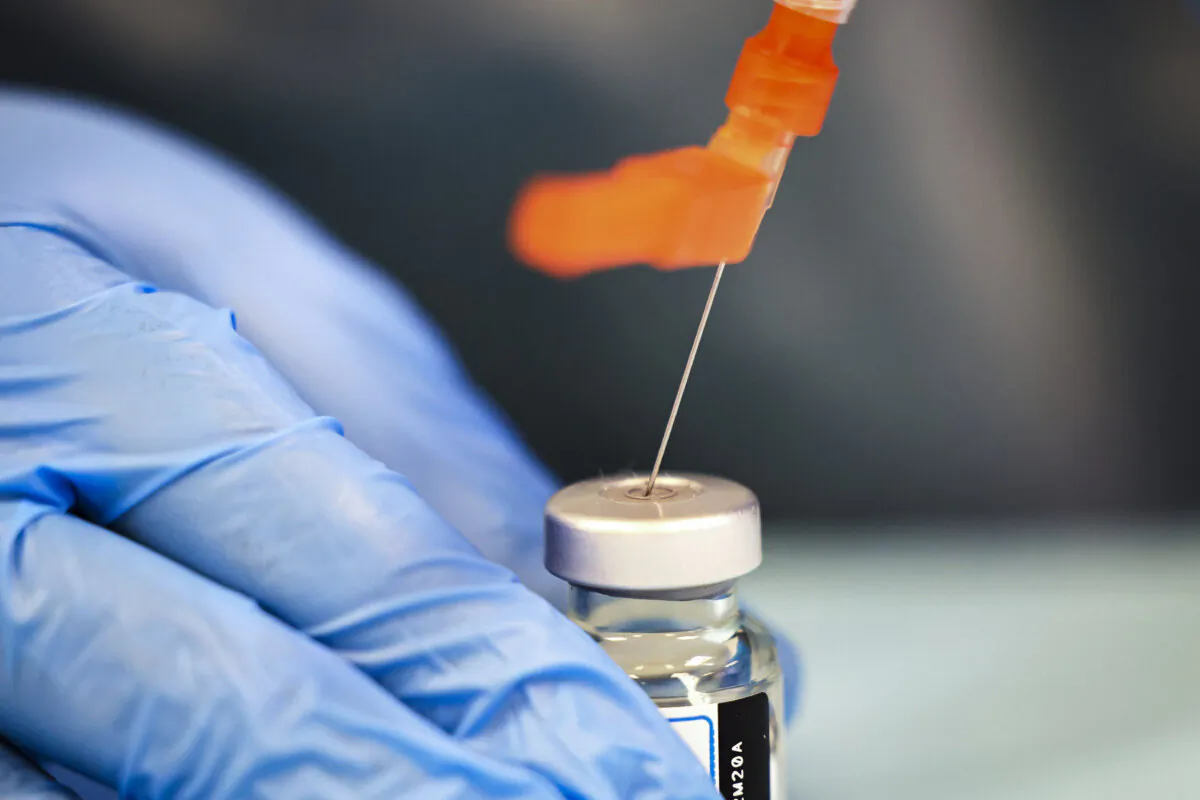 A health care worker in New York prepares a Moderna vaccine in a file photograph. (Michael M. Santiago/Getty Images)