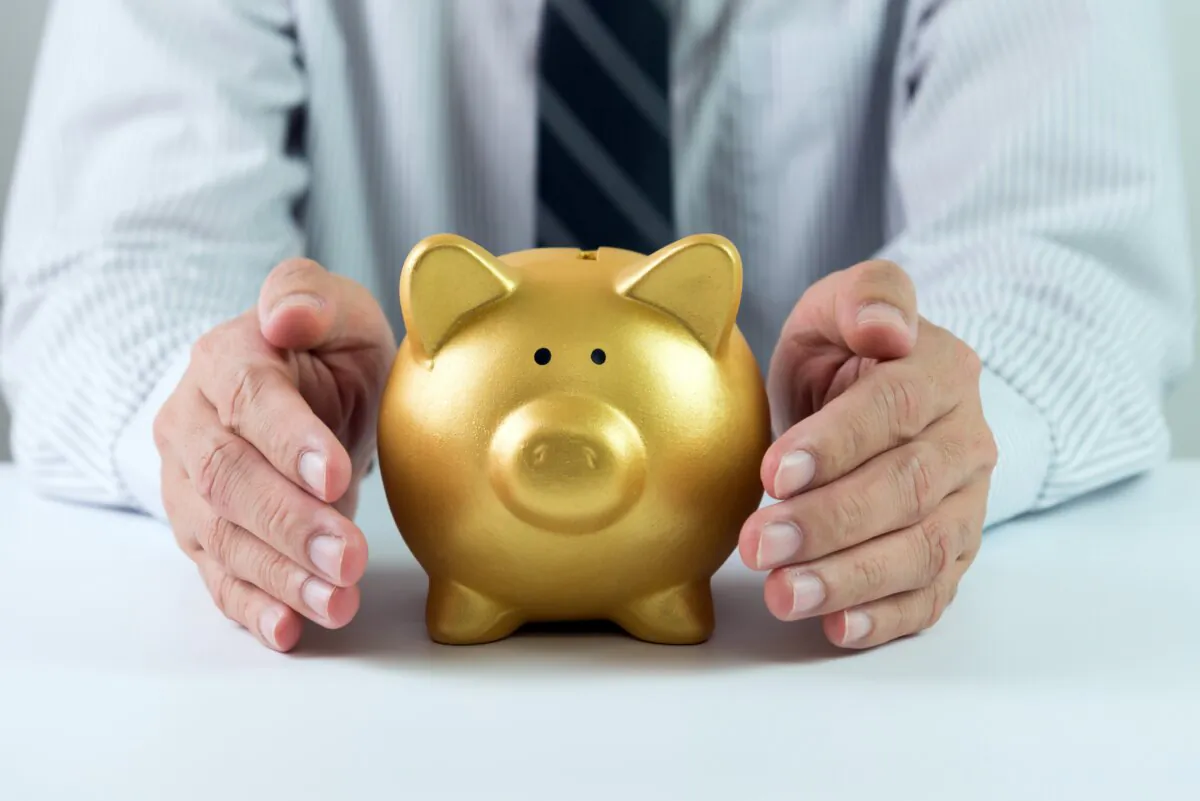 Lower interest rates could make holding too much cash increasingly costly over time. (Kenishirotie
/Shutterstock)