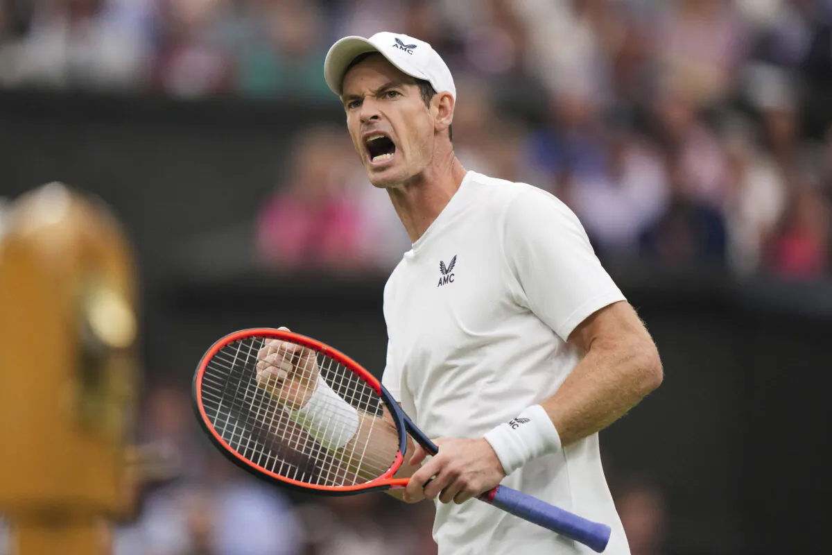 Britain's Andy Murray celebrates winning a point from Britain's Ryan Peniston during the first round men's singles match on day two of the Wimbledon tennis championships in London on July 4, 2023. (Alberto Pezzali/AP Photo)