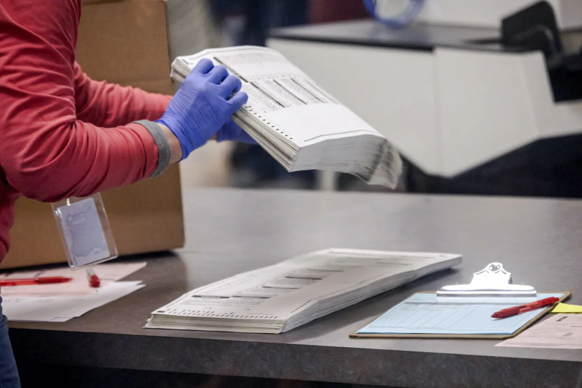 An election worker sorts ballots in Arizona, in a file photo. (John Moore/Getty Images)