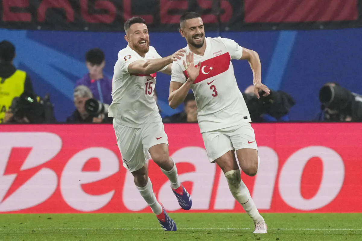 Turkey's Merih Demiral (R) celebrates with Salih Ozcan after scoring his side's second goal during a round of sixteen match between Austria and Turkey at the Euro 2024 soccer tournament in Leipzig, Germany, on July 2, 2024. (Martin Meissner/AP Photo)