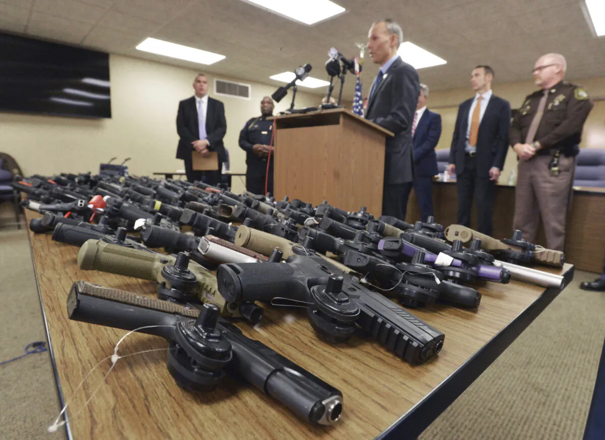U.S. Attorney for the Western District of Michigan Mark Totten talks about the more than 100 recovered stolen handguns during a news conference in Benton Township, Mich., on Nov. 21, 2023. (Don Campbell/The Herald-Palladium via AP, File)