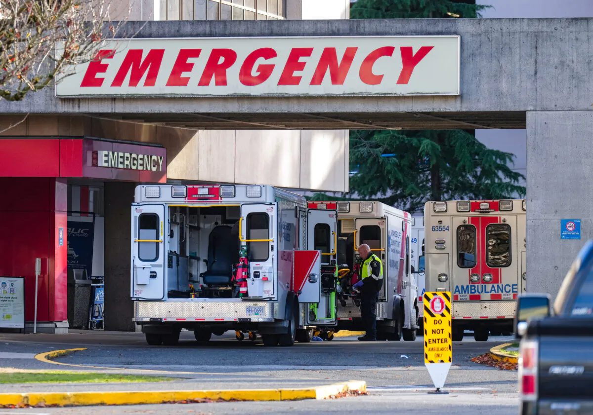 Ambulances are parked at the entrance to an emergency department in a file photo. (The Canadian Press/Darryl Dyck)