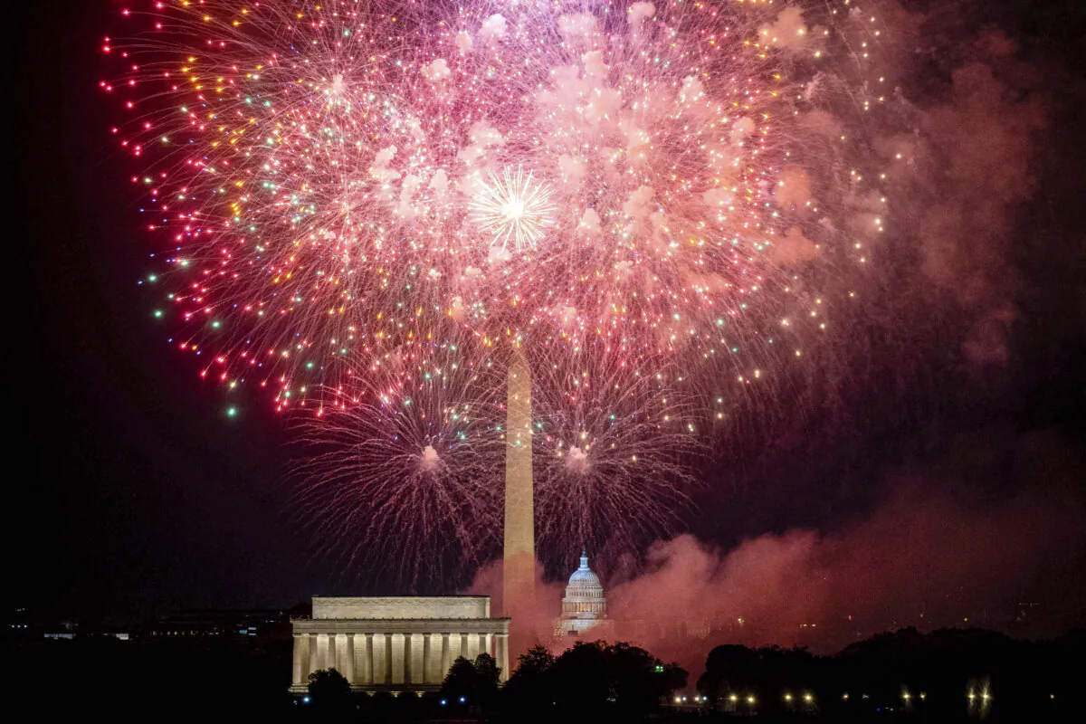 The U.S. Capitol and Washington Monument during the Independence Day fireworks display along the National Mall in Washington on July 4, 2023. (Stefani Reynolds/AFP via Getty Images)
