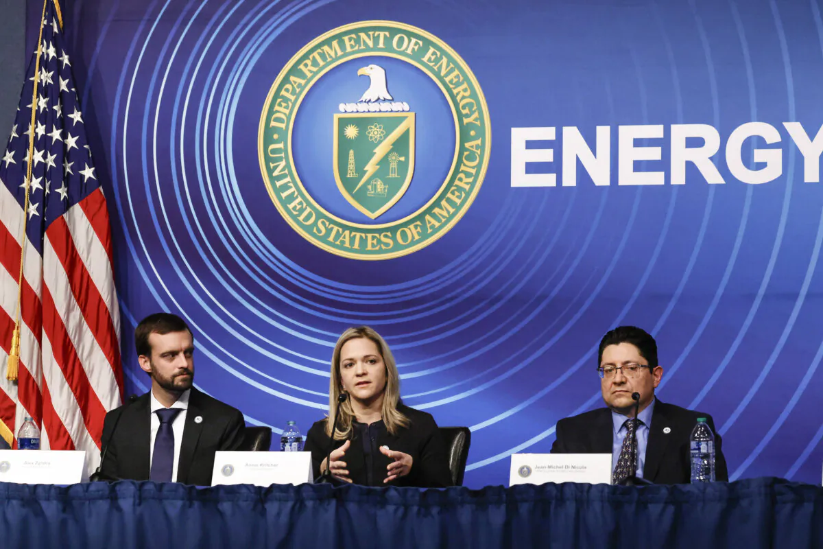 (L–R) Scientists from the Lawrence Livermore National Laboratories Alex Zylstra, Annie Kritcher, and Jean-Michel Di Nicola hold a news conference at the Department of Energy headquarters in Washington on Dec. 13, 2022. (Chip Somodevilla/Getty Images)