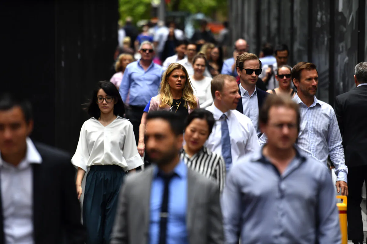 Office workers are seen at lunch break at Martin Place in Sydney, on Dec. 12, 2018. (AAP Image/Mick Tsikas) NO ARCHIVING