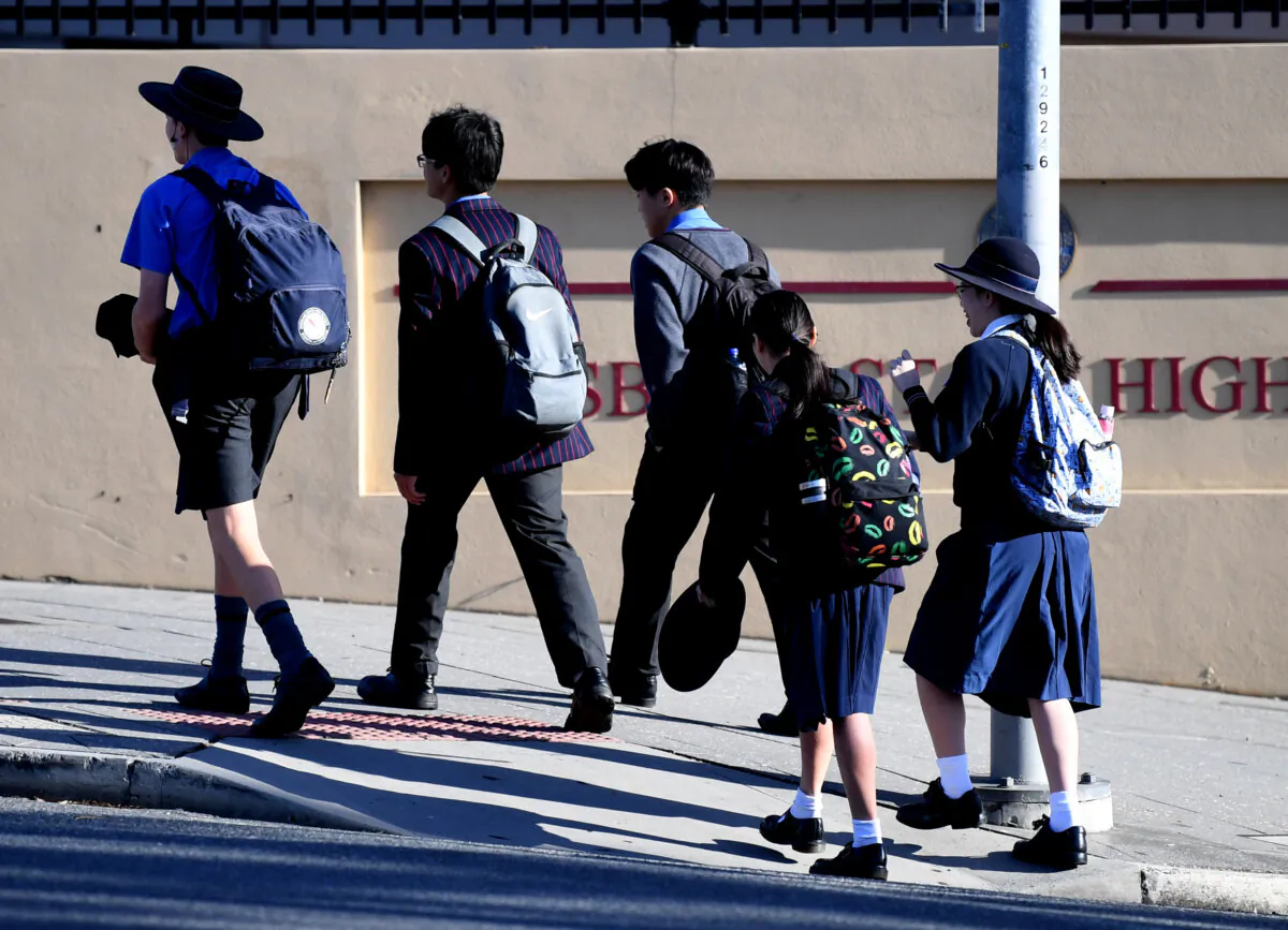 School students arrive for the first day of face-to-face school  in Brisbane, on May 11, 2020. (AAP Image/Dan Peled) 