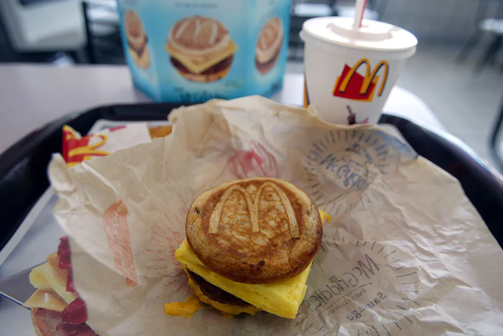 CORAL GABLES, FLORIDA - JUNE 12:  A cheese, sausage and egg McGriddles breakfast sandwich at a McDonald's is shown June 12, 2003 in Coral Gables, Florida. The new McGriddles breakfast sandwiches are made to eat between pancakes, with maple syrup baked right in, and different combinations of sausage, crispy bacon, fluffy eggs and melted cheese in a sandwich. (Photo by Joe Raedle/Getty Images)