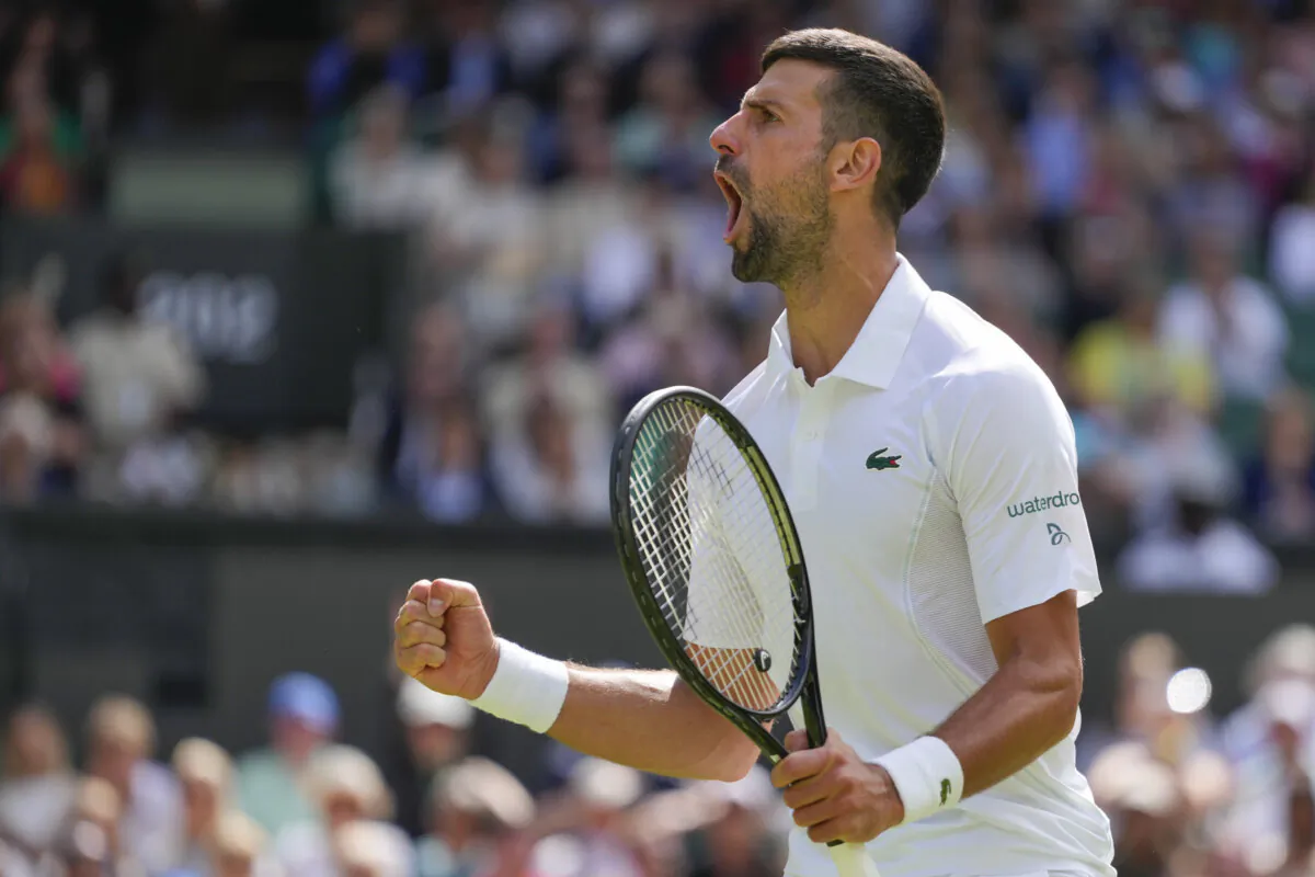 Serbia's Novak Djokovic reacts after winning a point against Britain's Jacob Fearnley during their second round match at the Wimbledon tennis championships in London on July 4, 2024. (Kirsty Wigglesworth/AP Photo)