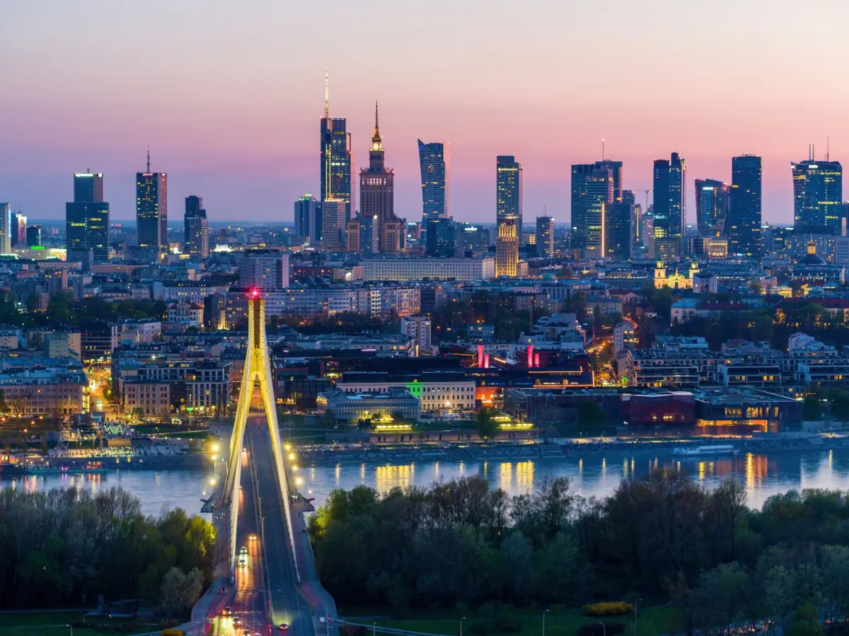 Evening falls over the city center, the Vistula River, and Swietokrzyski Bridge in Warsaw, Poland. (Lukasz Pawel Szczepanski/Shutterstock)