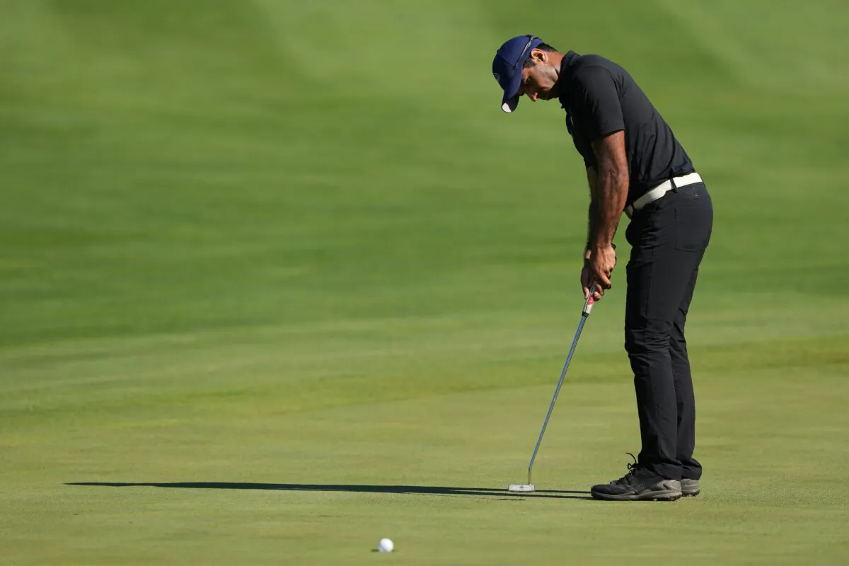 Aaron Rai of England lines putts on the 15th hole during the second round of the John Deere Classic at TPC Deere Run in Silvis, Ill., on July 5, 2024. (Dylan Buell/Getty Images)