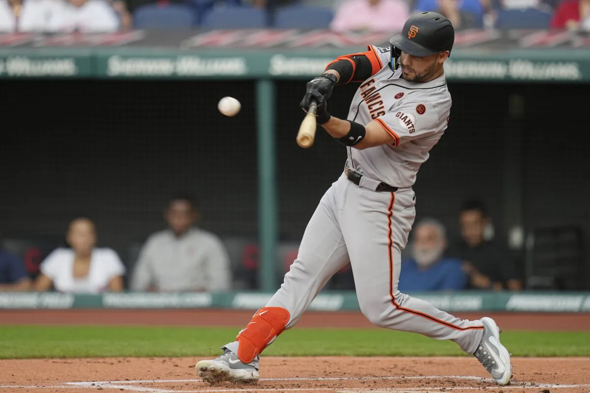 San Francisco Giants' Michael Conforto hits a double in the first inning of a baseball game against the Cleveland Guardians in Cleveland on July 5, 2024. (Sue Ogrocki/AP Photo)