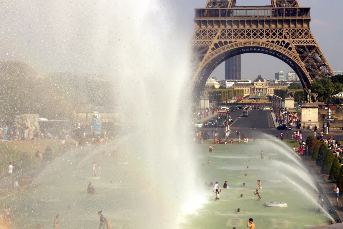 The Trocadero fountains by the Eiffel Tower in Paris provide a place to cool off from the summer heat. (Philippe Porter/Dreamstime/TNS)