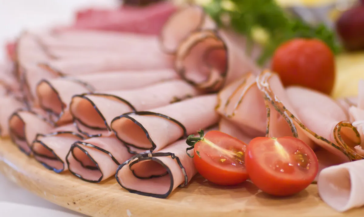 Ham and cheese sliders are easy to scale up for a crowd; they can be prepped ahead, glazed and baked off to serve, slightly crusty at the edges, and piping hot. (Sebastian Czapnik/Dreamstime/TNS)