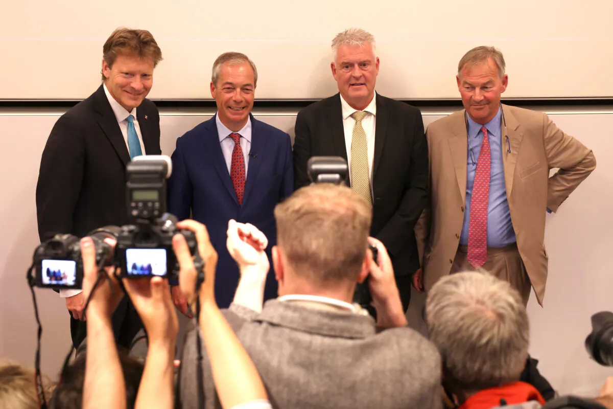 Chairman of Reform UK, Richard Tice, Leader of Reform UK, Nigel Farage, MP for Ashfield, Lee Anderson and MP for Great Yarmouth, Rupert Lowe pose for the media, in London, England on July 5, 2024. (Dan Kitwood/Getty Images)
