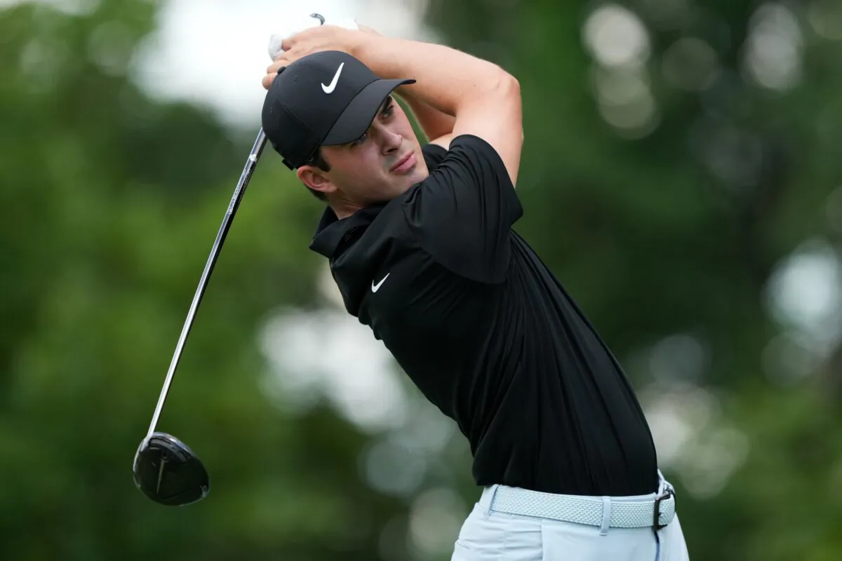 Davis Thompson of the United States hits his tee shot on the 15th hole during the third round of the John Deere Classic in Silvis, Ill., on July 6, 2024. (Dylan Buell/Getty Images)