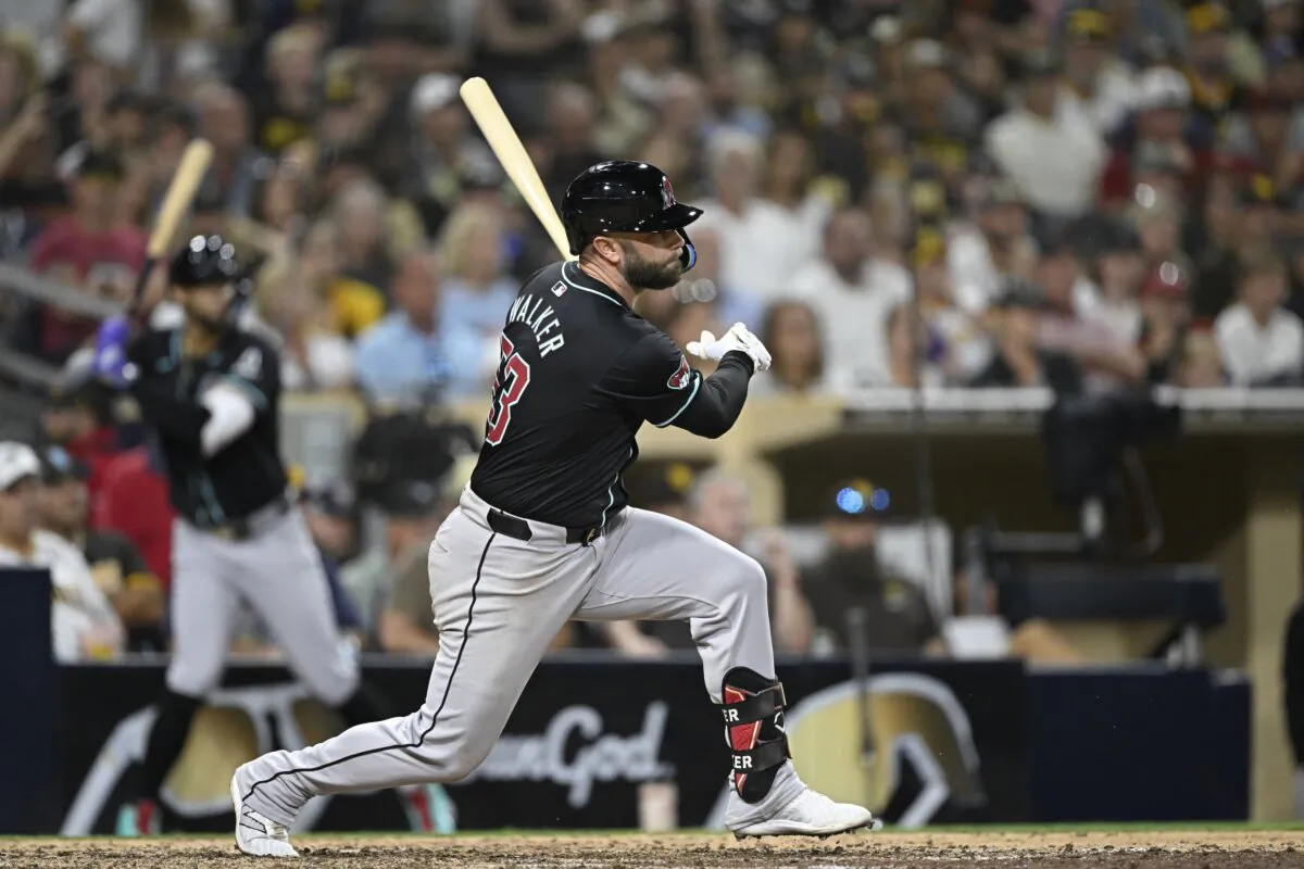Christian Walker (53) of the Arizona Diamondbacks hits an RBI single during the tenth inning of a baseball game against the San Diego Padres in San Diego on July 6, 2024. (Denis Poroy/Getty Images)