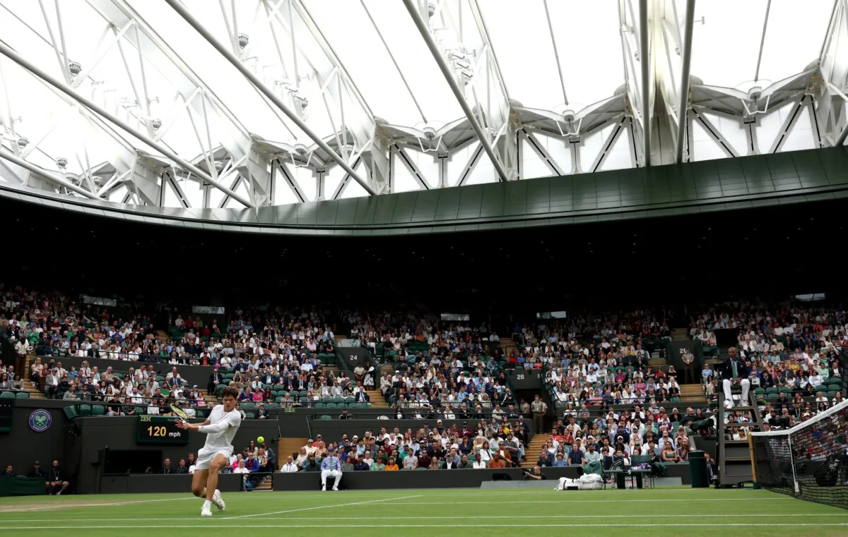 Ben Shelton of United States plays a backhand against Jannik Sinner of Italy in his Gentleman's Singles fourth round match during day seven of The Championships Wimbledon 2024 in London on July 7, 2024. (Francois Nel/Getty Images)