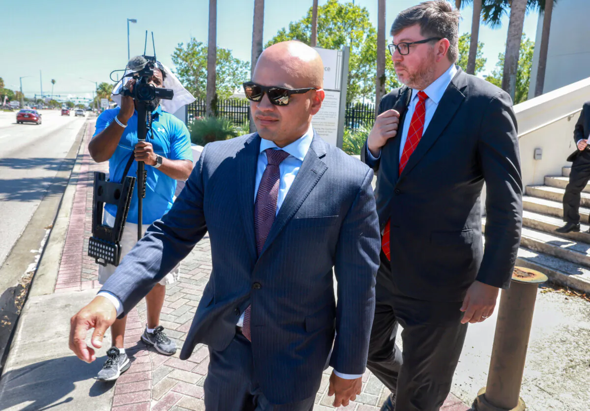 Walt Nauta (L), an aide to former President Donald Trump, walks with his lawyer, Stanley Woodward (R), as they leave the Alto Lee Adams Sr. U.S. Courthouse in Fort Pierce, Fla., on May 22, 2024. (Joe Raedle/Getty Images)