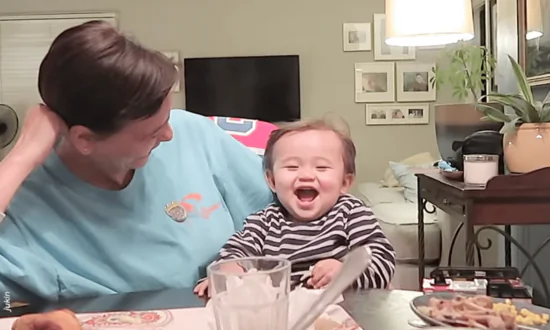 Baby Makes Funny Faces While Sitting at Dinner Table Making Everyone Laugh Out Hard