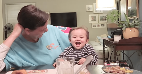 Baby Makes Funny Faces While Sitting at Dinner Table Making Everyone Laugh Out Hard