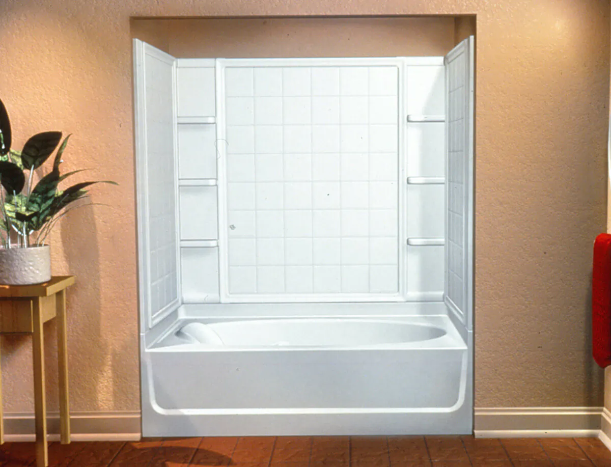 The modular pieces of the surround fit together and feature cutouts for plumbing and the fixtures. (Sterling/TNS)