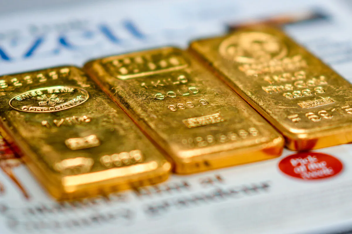 Three 1-kilogram gold bullion bars in the jewelry quarter in Birmingham, England, on Dec. 13, 2023. (Christopher Furlong/Getty Images)