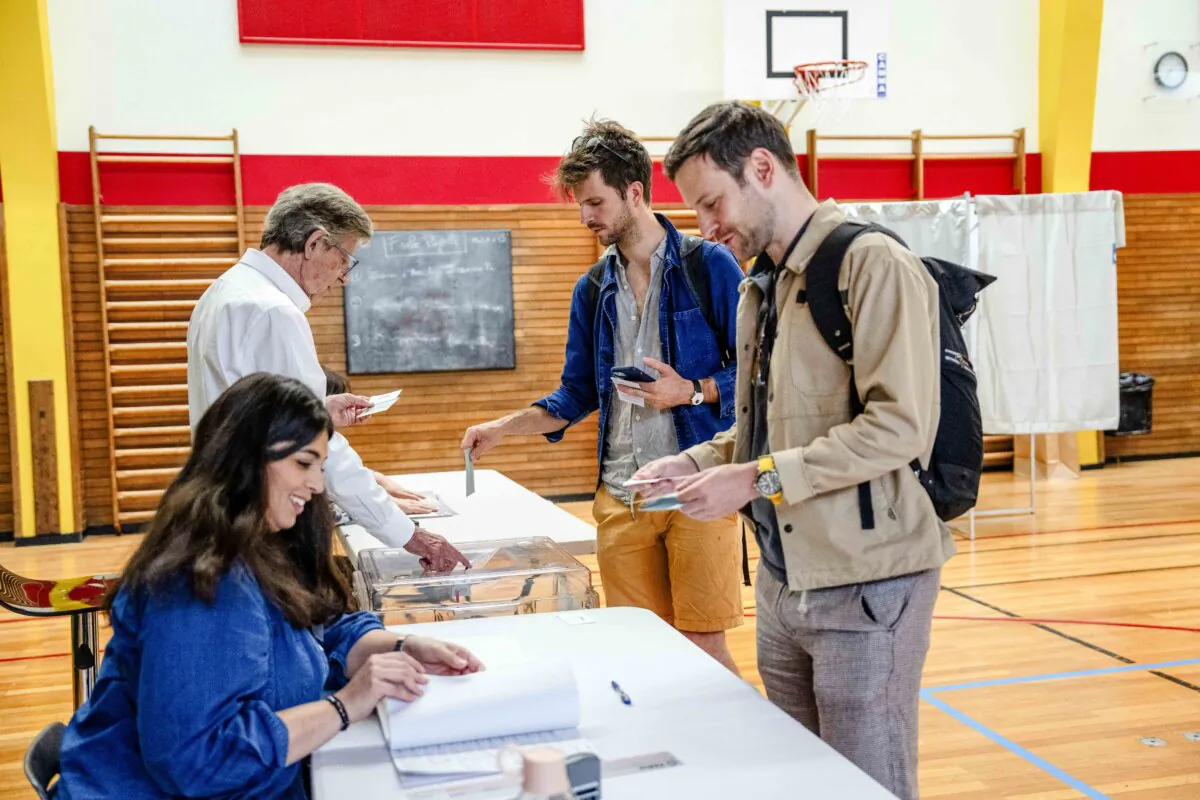 A man casts his vote in the second round of the parliamentary elections in Paris on July 7, 2024. (Carl Court/Getty Images)