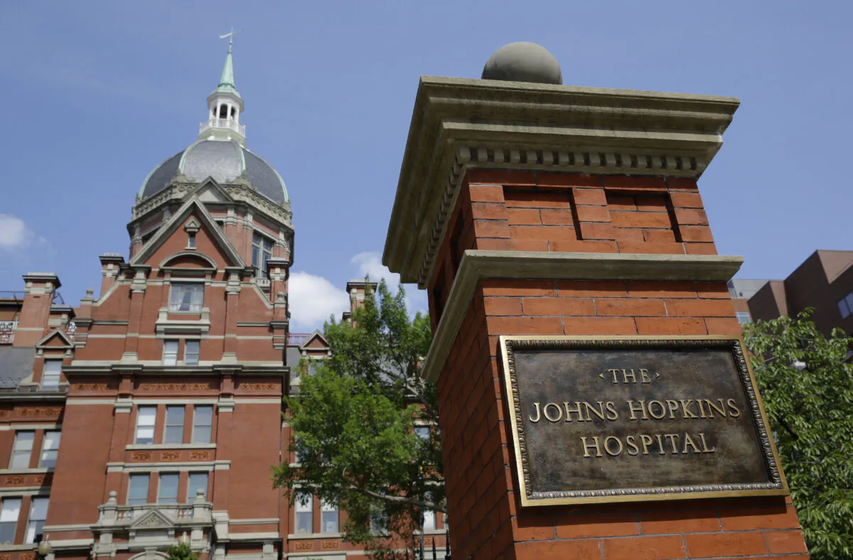 A sign stands in front of part of the Johns Hopkins Hospital complex in Baltimore, Md., on July 8, 2014. (AP/Patrick Semansky, file)