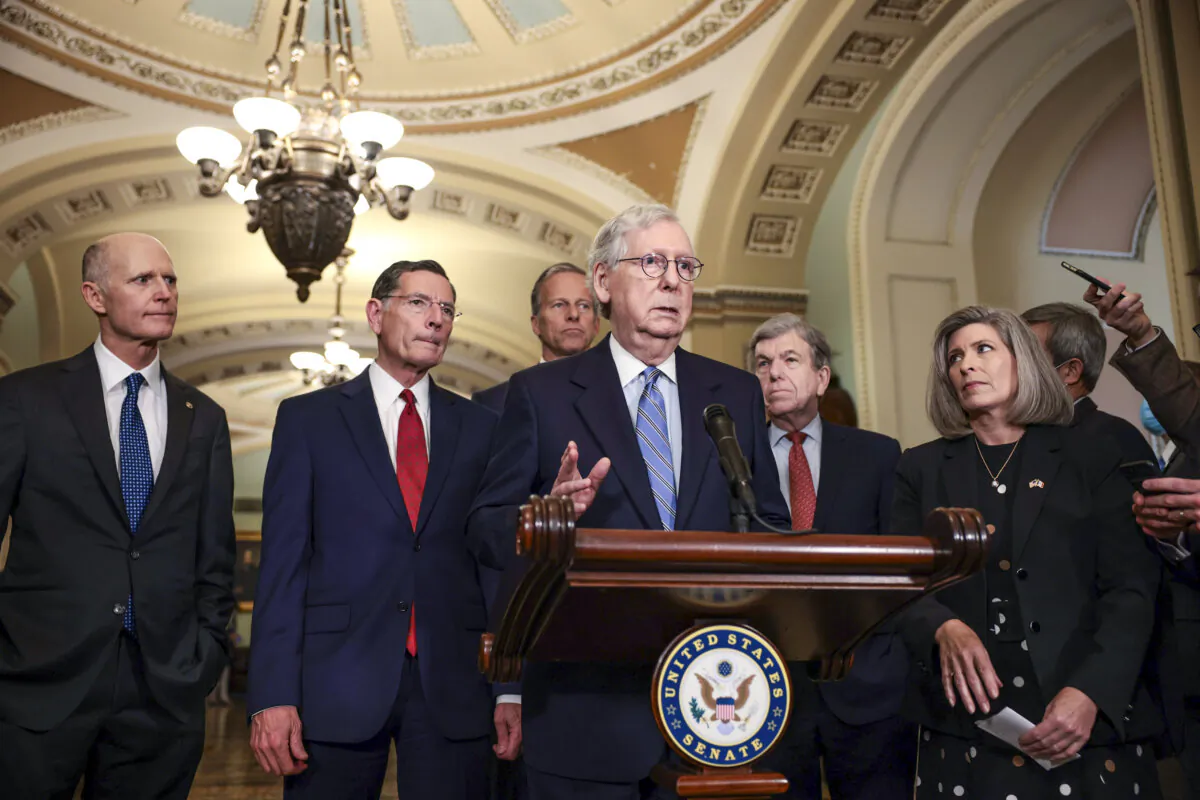 Senate Minority Leader Mitch McConnell (R-Ky.) (C) addresses reporters as (L–R) Sens. Rick Scott (R-Fla.), John Barrasso (R-Wyo.), John Thune (R-S.D.), Roy Blunt (R-Mo.), and Joni Ernst (R-Iowa) listen in Washington, on Oct. 5, 2021. (Anna Moneymaker/Getty Images)
