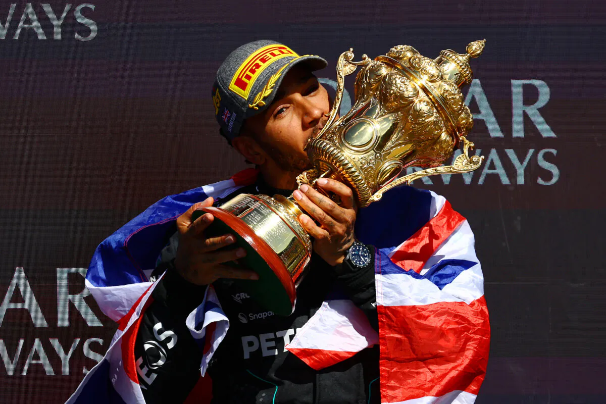 Lewis Hamilton of Mercedes celebrates on the podium during the F1 Grand Prix of Great Britain at Silverstone Circuit in Northampton, England on July 07, 2024. (Mark Thompson/Getty Images)