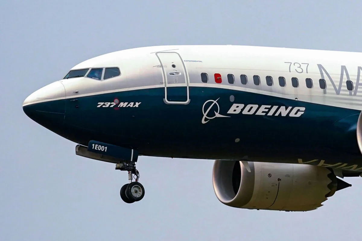 A Boeing 737 Max jet prepares to land at Boeing Field following a test flight in Seattle on Sept. 30, 2020. (Elaine Thompson/AP Photo)