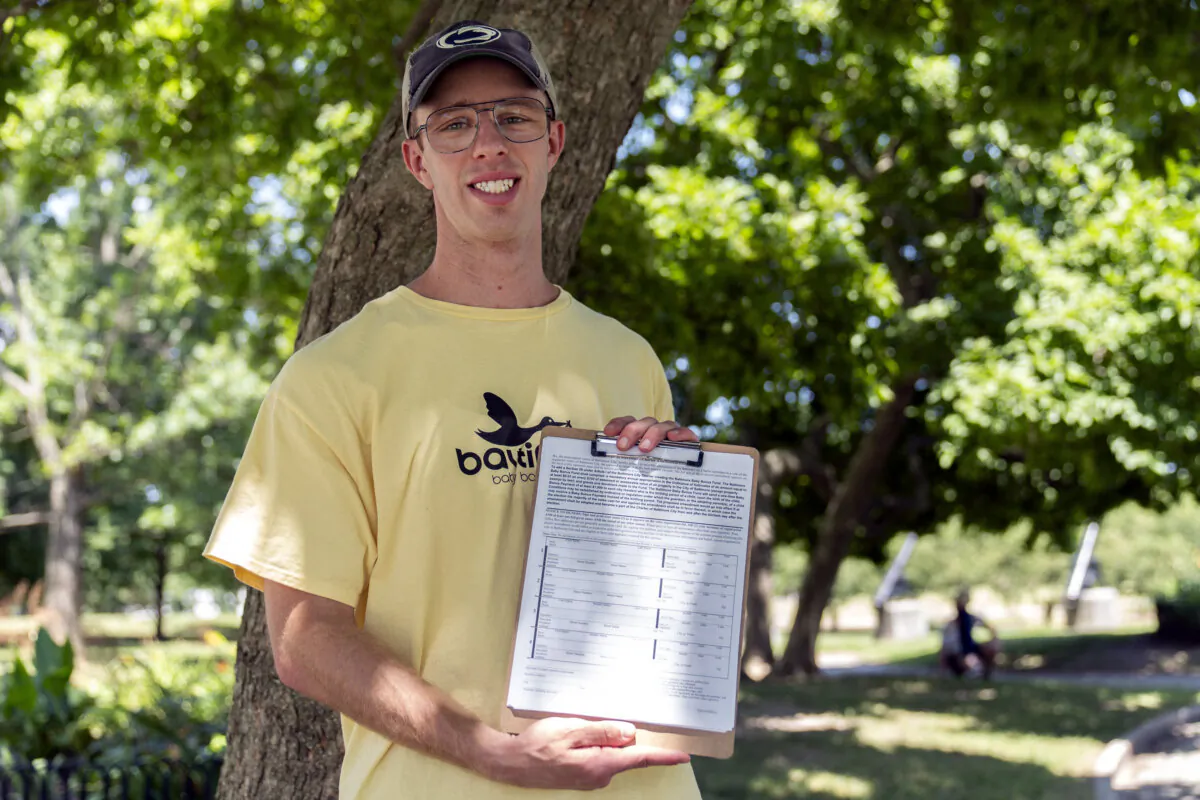 Nate Golden, president of the Maryland Child Alliance, poses for a portrait with a petition form for the Baltimore Baby Fund, in Baltimore, Md., on July 3, 2024. (Stephanie Scarbrough/AP Photo)