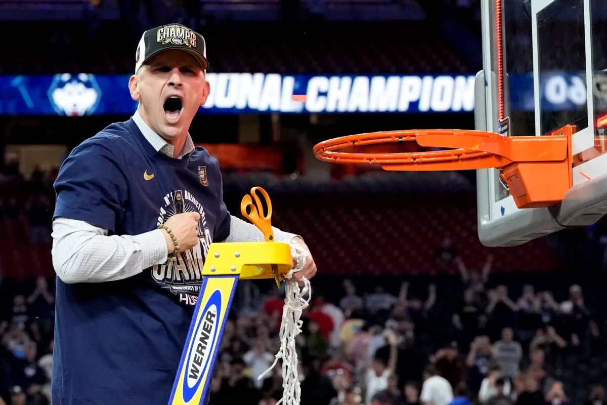 Coach Dan Hurley cuts down the net after UConn's NCAA championship game win over Purdue in Glendale, Ariz., on April 8, 2024. (David J. Phillip/AP Photo)
