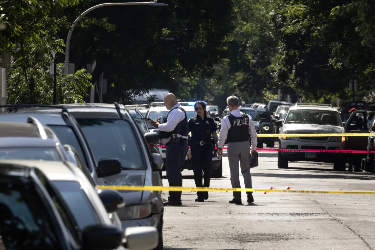 Police investigate the scene of a drive-by shooting in Chicago on July 6, 2024. (Scott Olson/Getty Images)