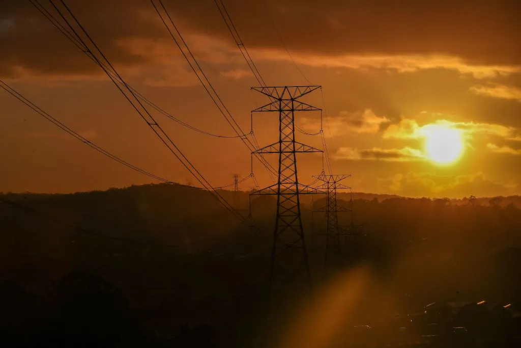 High voltage electricity transmission towers are shown at Cameron Park in Lake Macquarie, Australia, on May 8, 2024. (Roni Bintang/Getty Images)