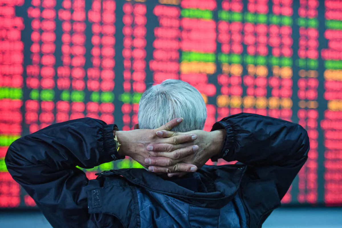 An investor looks at a screen showing stock market movements at a securities company in Hangzhou, in eastern China's Zhejiang Province on Feb. 8, 2024. (STR/AFP via Getty Images)