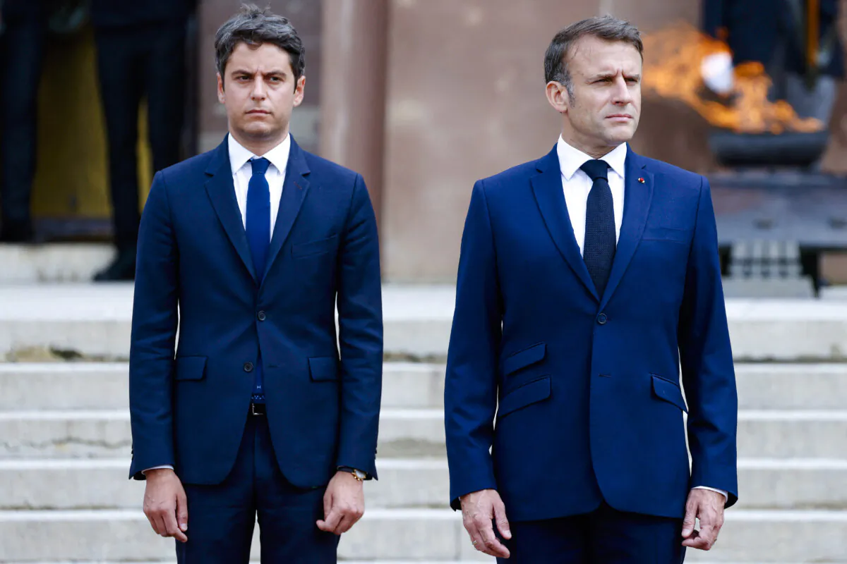 French President Emmanuel Macron (R) and France's Prime Minister Gabriel Attal attend a ceremony at the Mont-Valerien memorial in Suresnes, outside Paris on June 18, 2024. (Ludovic Marin/Pool/AFP via Getty Images)