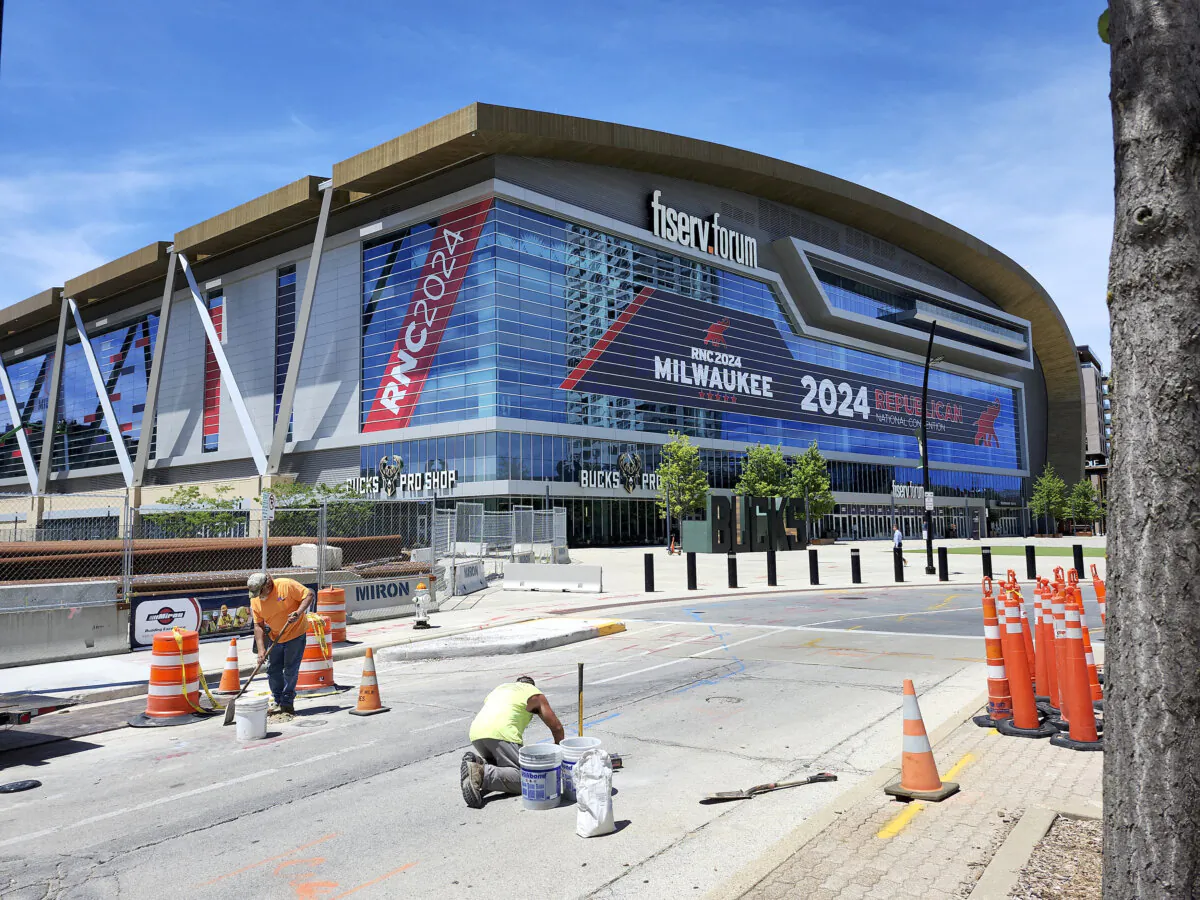 Workers repair a roadway outside Fiserv Forum ahead of the Republican National Convention in Milwaukee, Wis., on July 1, 2024. (Tannen Maury/AFP via Getty Images)